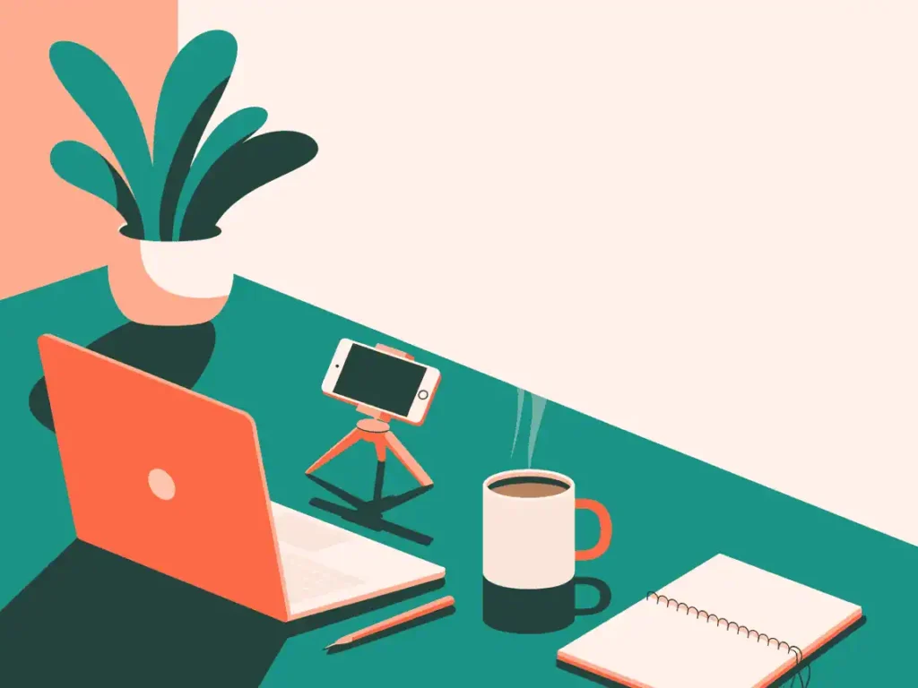Simple teacher desk setup with laptop, phone tripod, and coffee mug, perfect for home YouTube video creation.