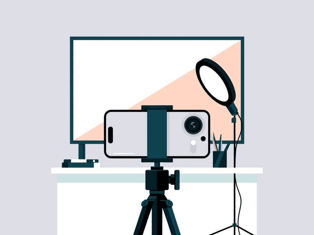 Filming setup with smartphone on tripod in front of a ring light and monitor: ideal for teachers recording YouTube lessons. 